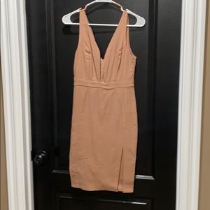 Dress. Tan. Low cut.